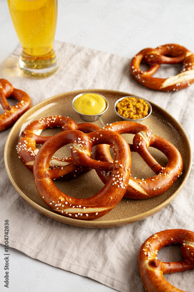 Homemade Bavarian-Style Soft Pretzels with Salt and Beer, side view. Homemade Bavarian-Style Soft Pretzels with Salt and Beer, side view.