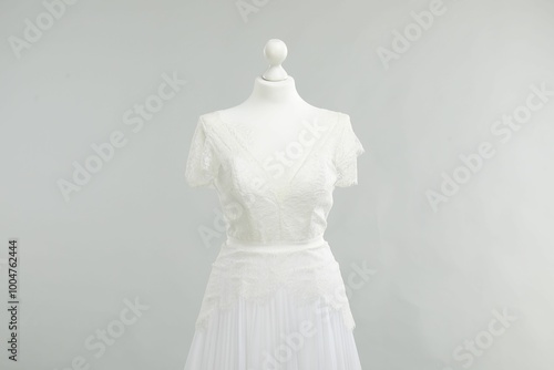 Mannequin with beautiful wedding dress on light grey background