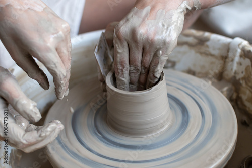 Making of mud pot on potters wheel during workshop in art ceramic atelier in Poland