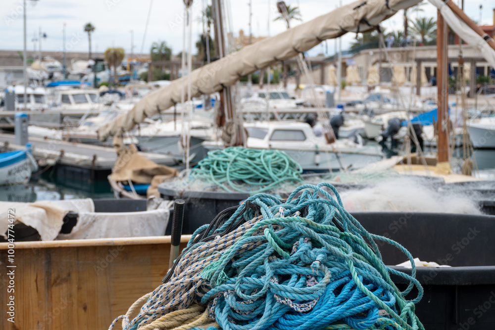 Fisherman's boats, tackles and nets in harbour of coastal town Menton, French Riviera, France, close up Fisherman's boats, tackles and nets in harbour of coastal town Menton, French Riviera, France, close up