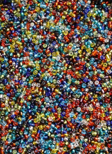 Mulitcolored small glass beads, closeup photo