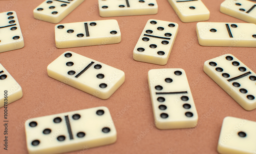 Dominoes bones on brown background Dominoes bones on brown background