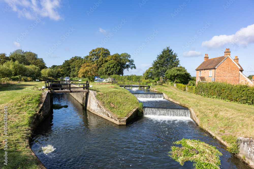 View of historic 17th century Papercourt lock and overspill weir located close to Ripley and Pyrford near to Guildford in Surrey View of historic 17th century Papercourt lock and overspill weir located close to Ripley and Pyrford near to Guildford in Surrey
