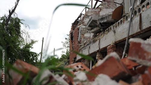 View to destroyed residential buildings at Kharkivska oblast. Ruined houses after bomb attacks on ukrainian territory from russia army. Consequences of russian invasion of Ukraine. Slow motion photo