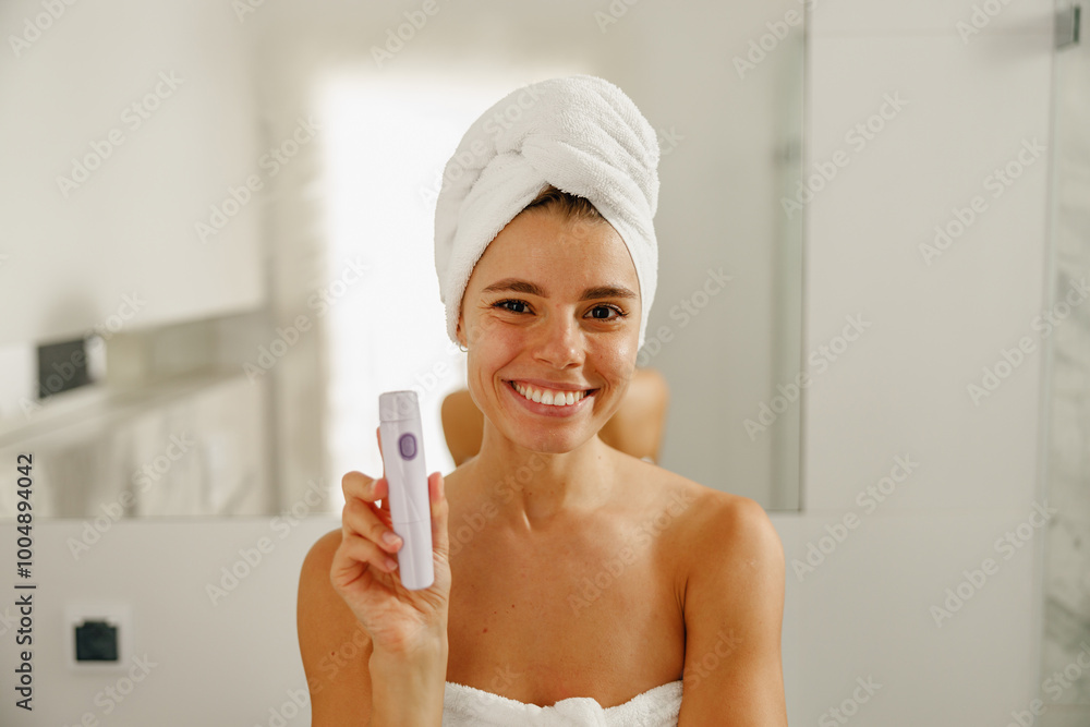 A happy woman is showcasing a luxurious skincare product, just refreshed from a soothing shower in a stylish bathroom A happy woman is showcasing a luxurious skincare product, just refreshed from a soothing shower in a stylish bathroom