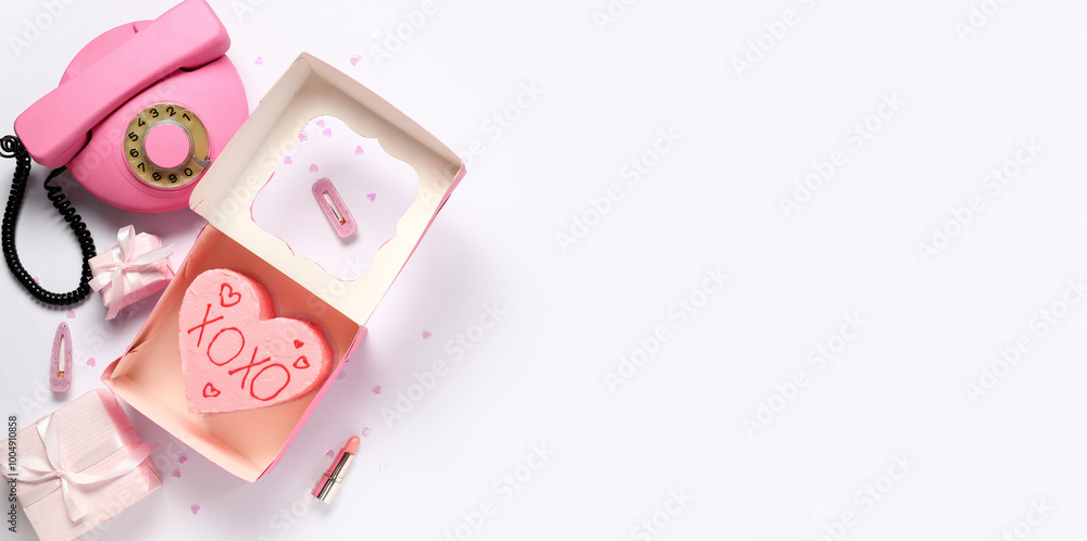 Box with tasty heart-shaped bento cake for Valentine's Day, female accessories, retro telephone and gifts on white background with space for text Box with tasty heart-shaped bento cake for Valentine's Day, female accessories, retro telephone and gifts on white background with space for text