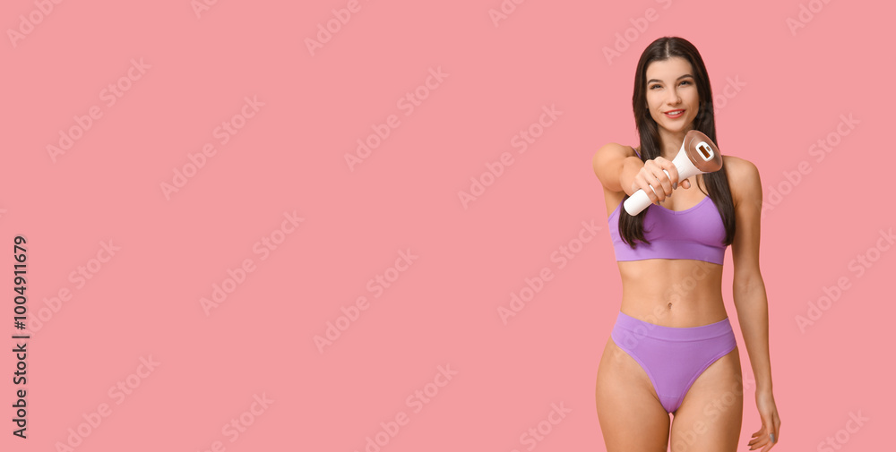 Naklejka premium Young woman holding modern photoepilator on pink background with space for text