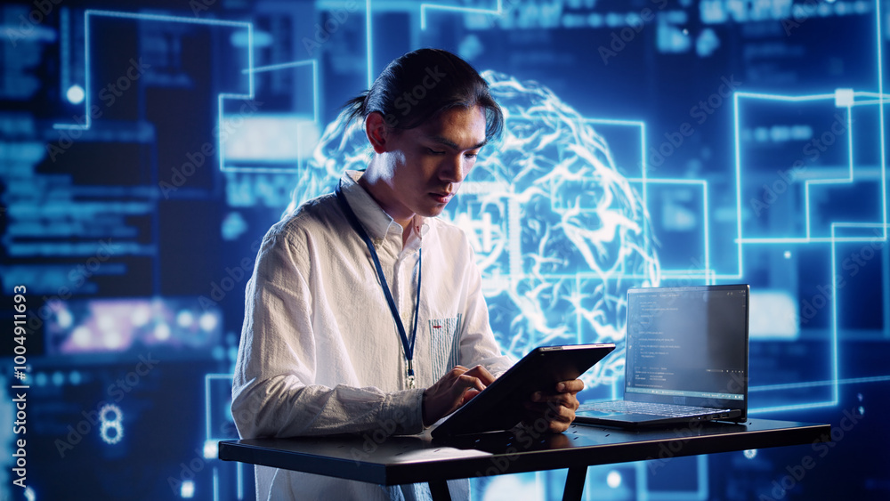 Productive engineer in high tech workspace uses artificial intelligence computing simulating human brain. Admin in server farm running operations on laptop with AI machine learning algorithms Productive engineer in high tech workspace uses artificial intelligence computing simulating human brain. Admin in server farm running operations on laptop with AI machine learning algorithms