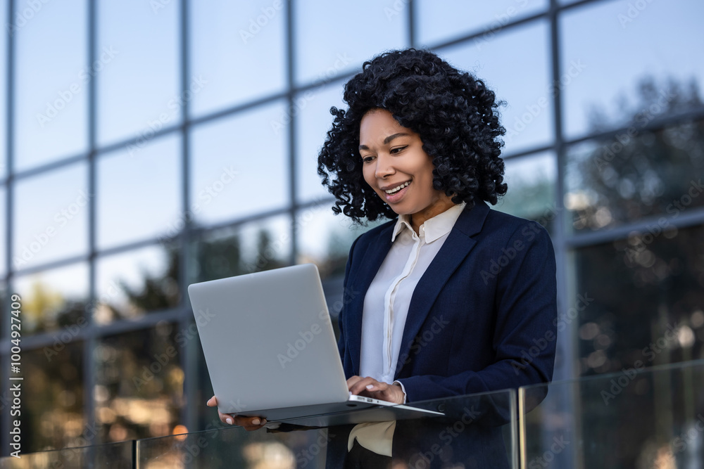 Elegant good-looking business woman with a laptop Elegant good-looking business woman with a laptop