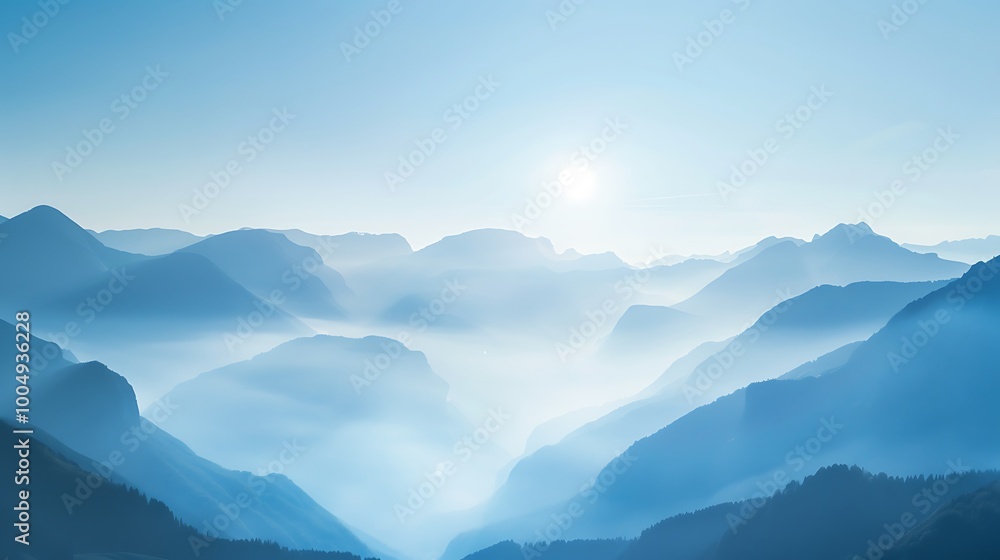 Experience the tranquility of a stunning mountain landscape at dawn with mist cascading over the peaks and a clear blue sky creating an inviting atmosphere for adventure lovers