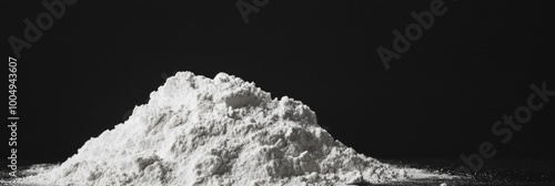 Macro image of a pile of flour on a black background