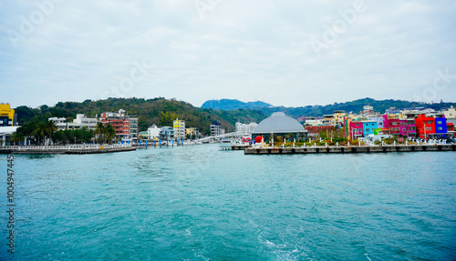 Kaohsiung, Taiwan, Republic of China, 01 25 2024: The landscape of Kaosiung port harbor, downtown,  seen on ferry boat from shiziwan (siziwan, xiziwan), and shoushan mountain to Cijin island photo