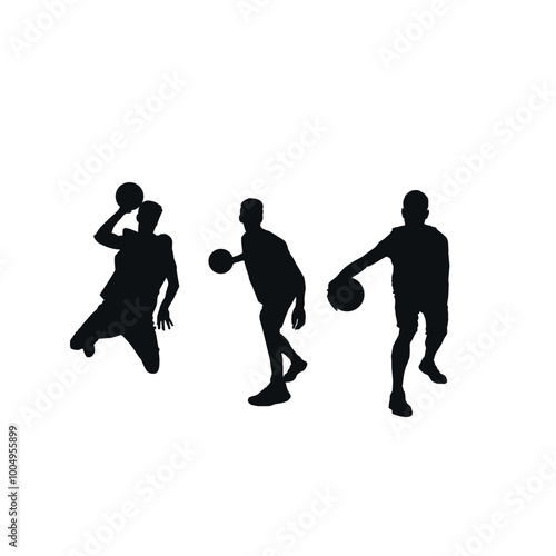 Silhouette of basketball players in action with the ball