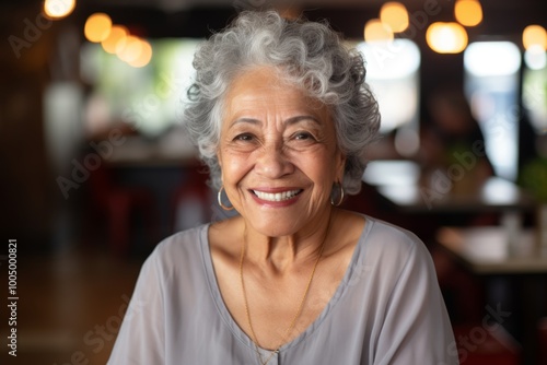 Portrait of a smiling latin woman in nursing home