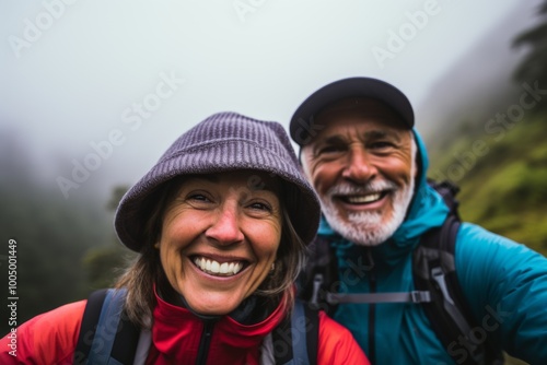 Smiling portrait of senior hikers taking selfie while hiking