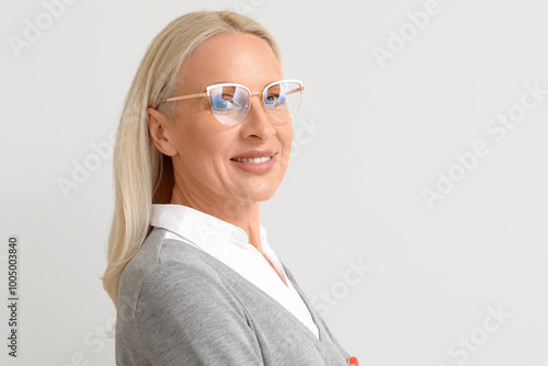 Mature blonde woman in eyeg...