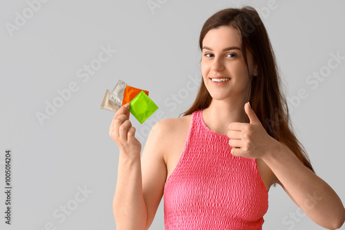 Young woman with condoms sh...