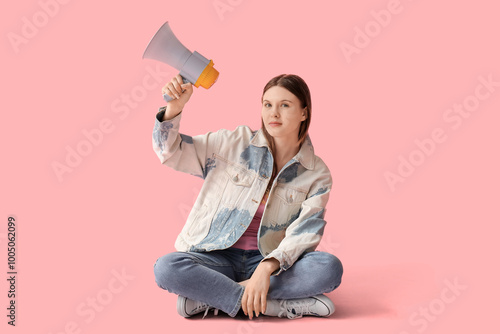 Young woman with megaphone ...