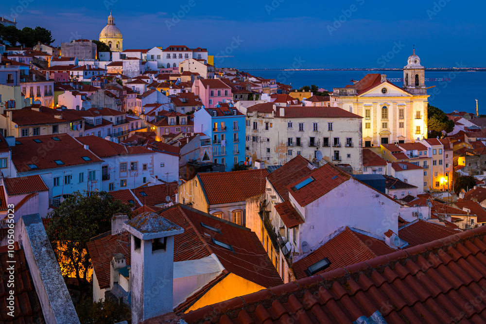 Twilight view of Alfama, one of Lisbon’s oldest areas with shops selling traditional crafts and cafes, Portugal