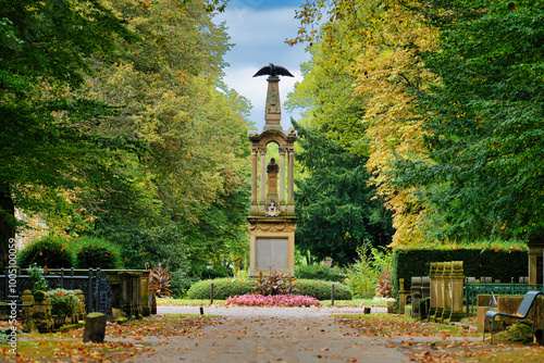 Eagle column and central square of the historic Melaten cemetery in Cologne in early fall photo