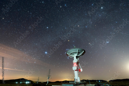 radio telescope on the background of stellar tracks, The observatory's radio telescope