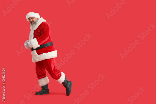 Dancing Santa Claus on red ...