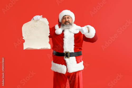 Santa Claus pointing at bla...