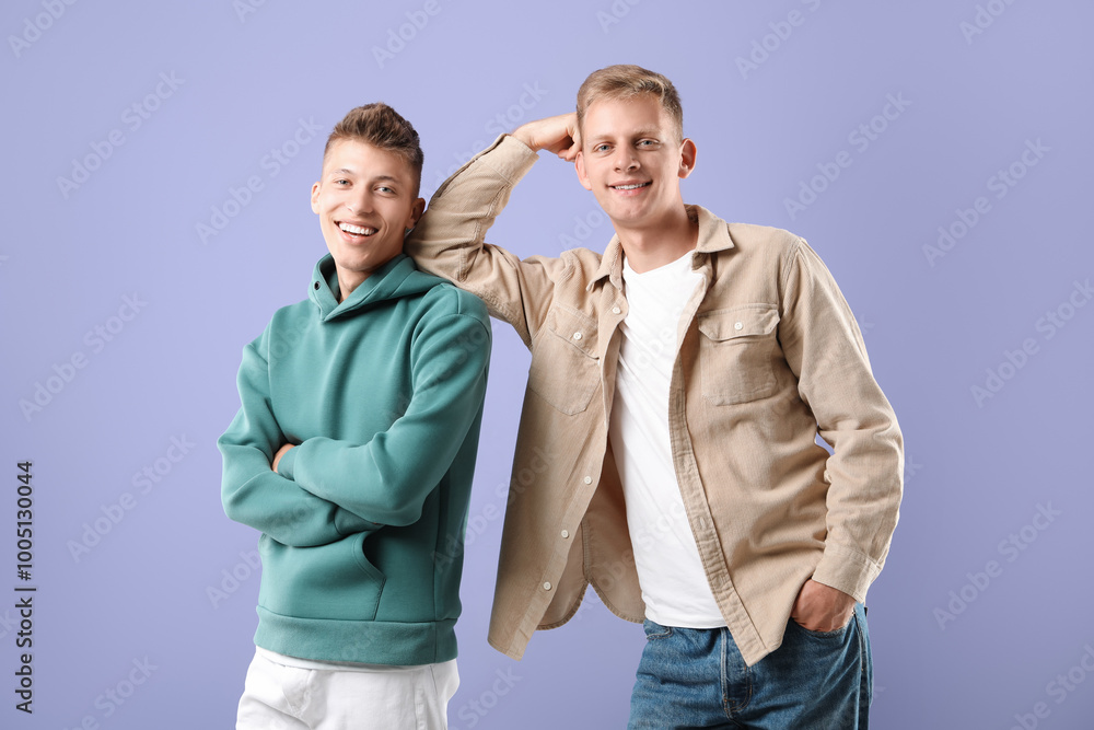 Portrait of happy brothers on violet background Portrait of happy brothers on violet background