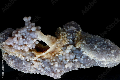 Collectible mineral Grape chalcedony or grape agate on a dark background, deposit Indonesia photo