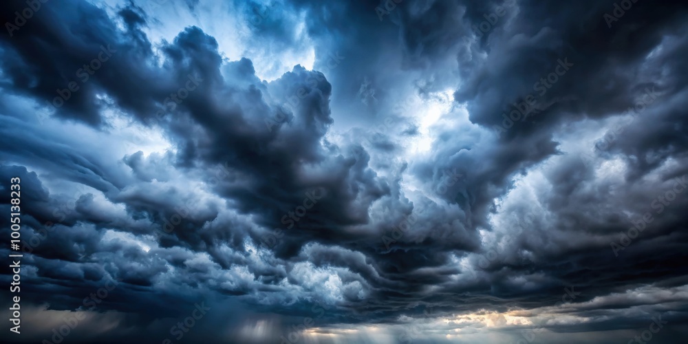 Dark sky with heavy clouds and faint light, ominous, atmospheric, stormy, overcast, gloomy, dramatic, moody, nature, weather