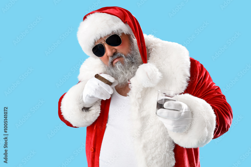 Bad Santa Claus with cigar and whiskey on blue background Bad Santa Claus with cigar and whiskey on blue background