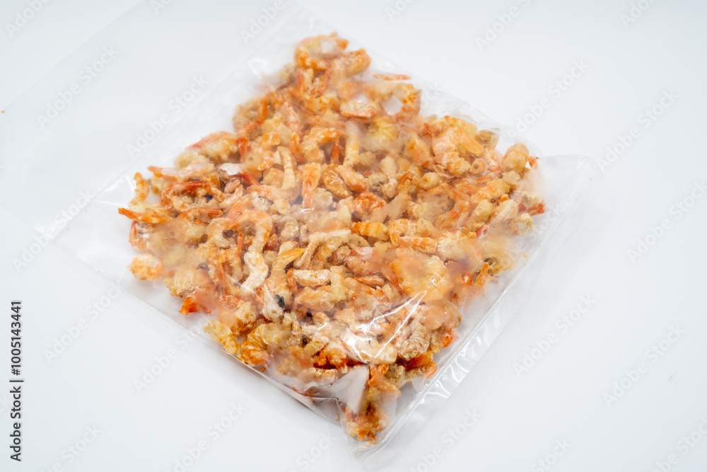 This vibrant image showcases a mound of dried shrimp, their orange hues glowing warmly against a softly lit backdrop. Each tiny crustacean is perfectly preserved, retaining its intricate form. This vibrant image showcases a mound of dried shrimp, their orange hues glowing warmly against a softly lit backdrop. Each tiny crustacean is perfectly preserved, retaining its intricate form.
