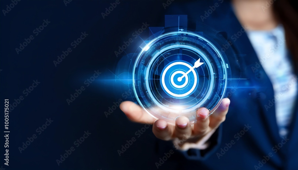 A person holds a glowing target symbol, representing focus and achievement, against a dark background, emphasizing innovation and technology. A person holds a glowing target symbol, representing focus and achievement, against a dark background, emphasizing innovation and technology.