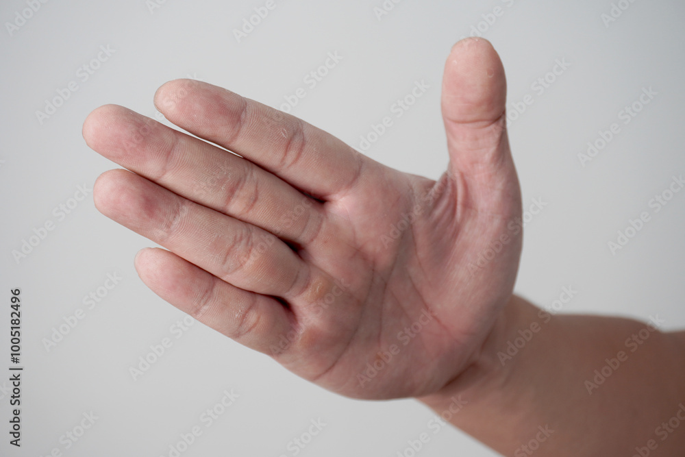 Hand of a person slapping gesture, over grey Hand of a person slapping gesture, over grey