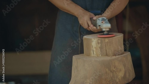 Grinding and smoothing detailed work on a timber log surface. Filmed in 4k 23.976 FPS