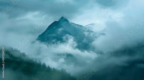 A mountain view shrouded in clouds and rain, evoking a sense of mystery.