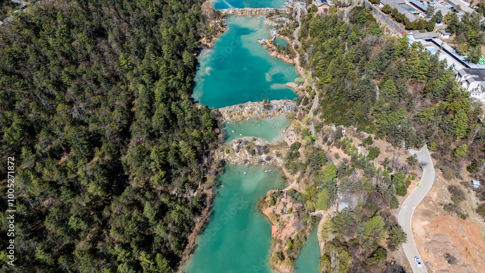Aerial view of Baisuihe river flowing through the Blue Moon Valley a popular spot inside the Jade Dragon Snow Mountain Scenic Area of Lijiang, in Yunnan province, China. Aerial view of Baisuihe river flowing through the Blue Moon Valley a popular spot inside the Jade Dragon Snow Mountain Scenic Area of Lijiang, in Yunnan province, China.
