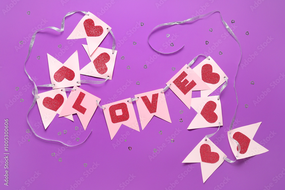 Garland made of paper flags with word LOVE on purple background. Valentine's Day celebration Garland made of paper flags with word LOVE on purple background. Valentine's Day celebration
