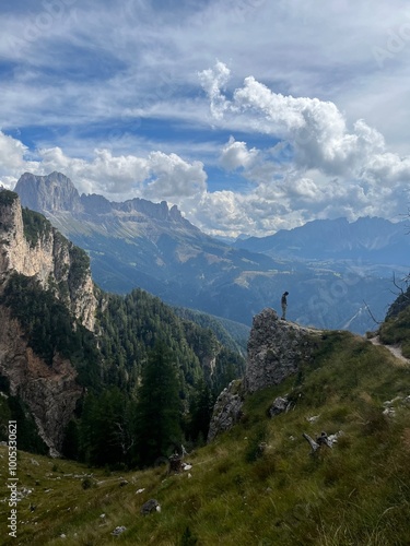Woman Hiking in the Italian Alps with Mountains Surrounding Her