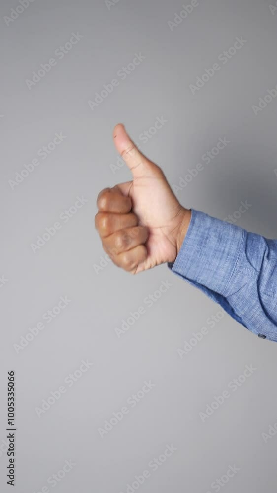 man hand showing a thumb-up man hand showing a thumb-up