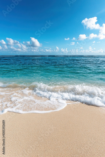 Ocean waves breaking on sand at tropical beach for vertical background