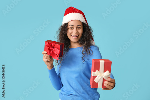 Happy young woman in santa ...