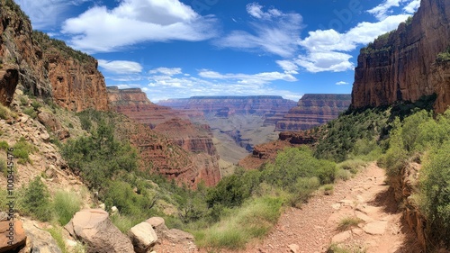 Breathtaking view of the Grand Canyon showcasing rocky cliffs and vibrant greenery.