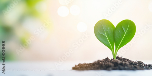 heart shaped plant sprout emerges from rich soil, symbolizing growth and new beginnings. This vibrant green plant captures essence of natures beauty and resilience