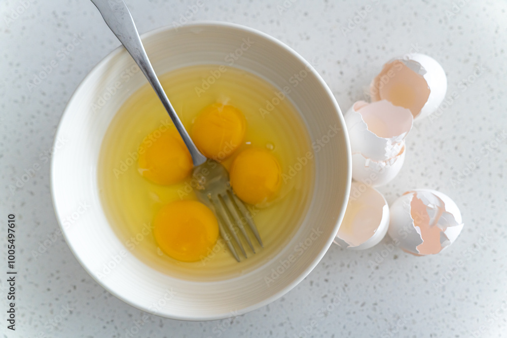 Egg yolks in white bowl ready to mix Egg yolks in white bowl ready to mix
