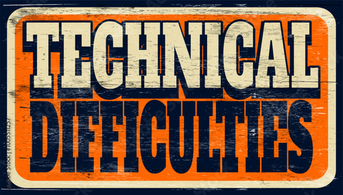 Aged vintage technical difficulties sign on wood