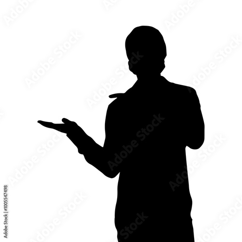 The silhouette of a man holding something in his hand.