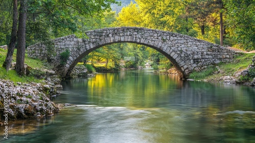 A serene stone bridge over a tranquil river, surrounded by lush greenery and reflections of nature's beauty.