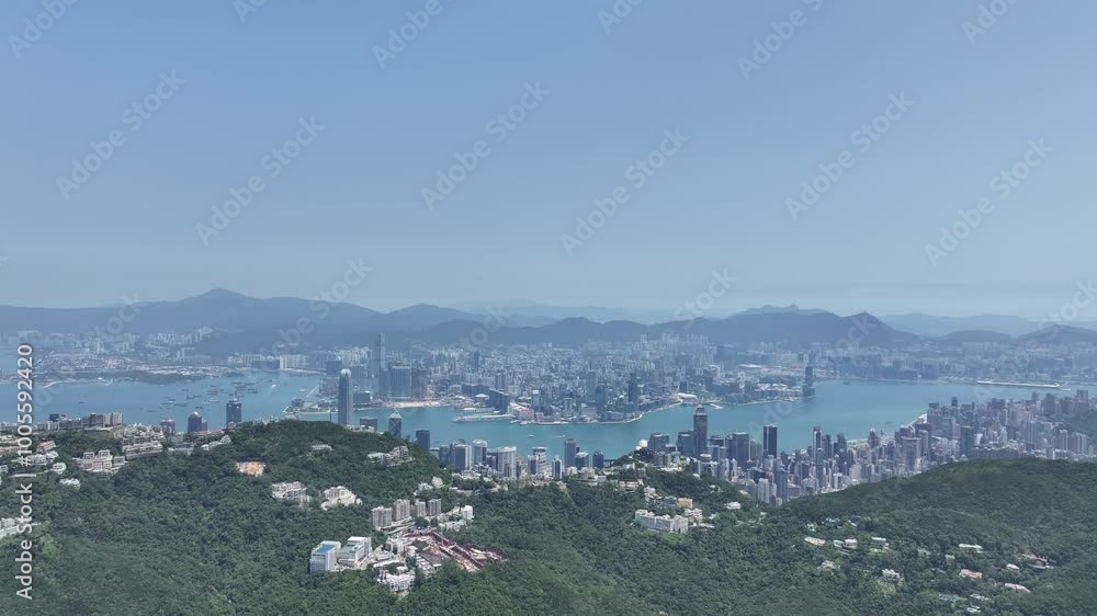 City Skyview in Hong Kong Island 4K Aerial shot of the peak premium residential mansion villa area at mid level and the central financial business along the sides of the Victoria Harbour City Skyview in Hong Kong Island 4K Aerial shot of the peak premium residential mansion villa area at mid level and the central financial business along the sides of the Victoria Harbour