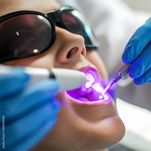 Dental Doctor Using Laser dental doctor using a laser to treat gum disease focusing on precision and patient safety